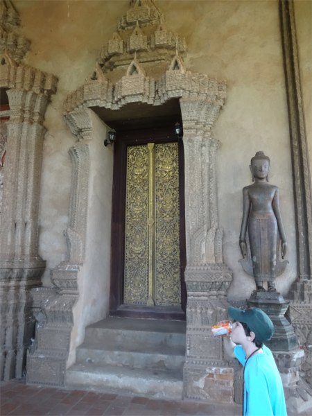 Alex stays hydrated in steamy Laos.