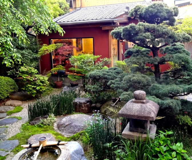 Meandering paths, stone lantern, water basin, Koi pond, rocks, flowers and manicured plants make the perfect zen garden in Kyoto.