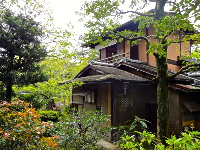 A traditional Japanese home is engulfed by Spring flowers and trees in Kyoto.  Large or small, homes in Japan make good use of the natural world outside the door.