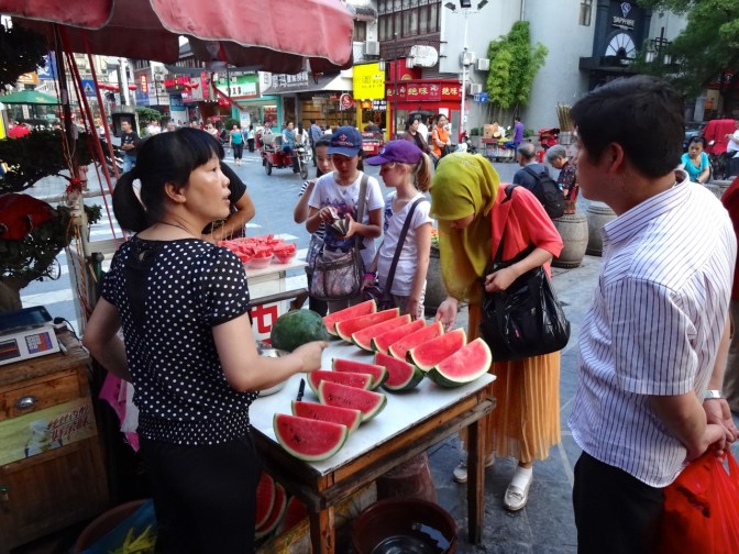 Fresh-cut watermelons at tje night markets in Guilin. Local markets at dusk is a nightly tradition all across Asia.