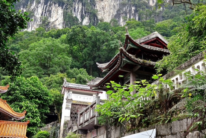 A Buddhist temple sits above the Li River near the main tour boat docks in Yangshuo.