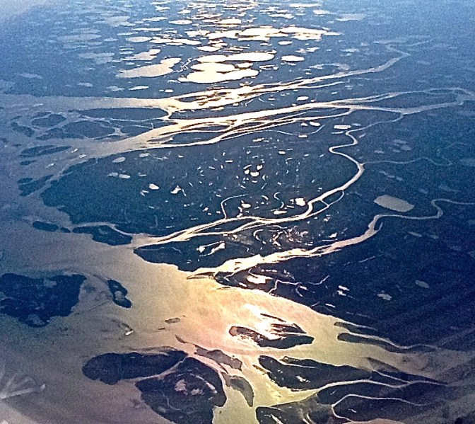 High above Canada, our flight from Detroit to Seoul took us near the Arctic Circle and the thousands of islands and waterways far north.