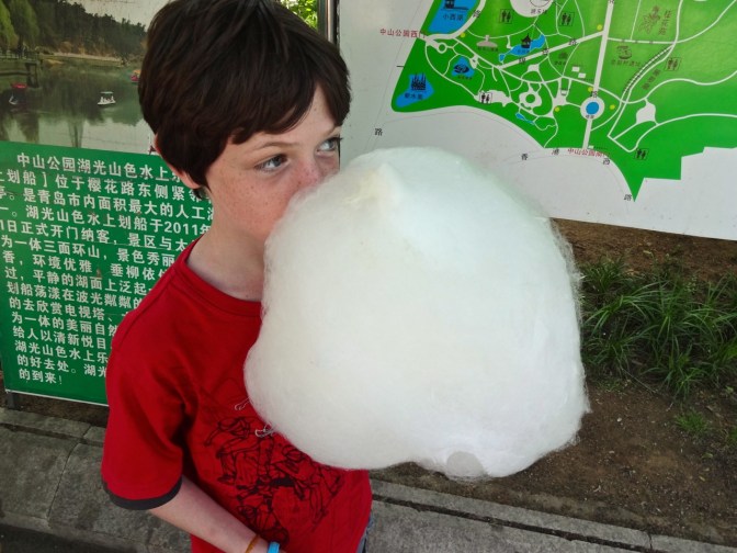 Who is eating who?  Larger than a Thanksgiving turkey, Alex dives into a pile of spun sugar, aka cotton candy, aka candy floss.