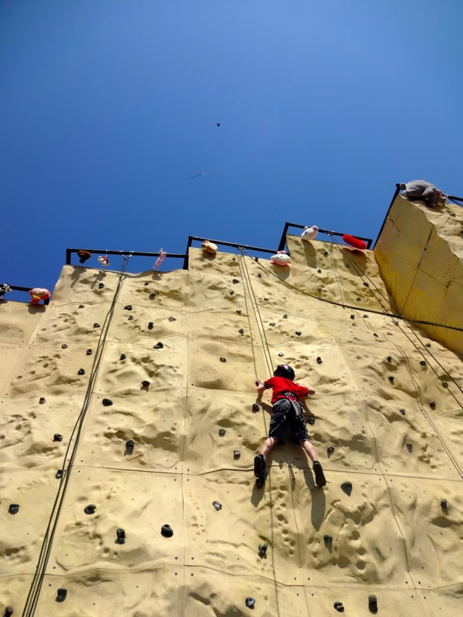 The same audience that watched Alex jump on bungee cords followed us over to the climbing wall and watched him go for Bunny Pillow gold minutes later. They did not follow us afterwords, however,  into the House of Mirrors.