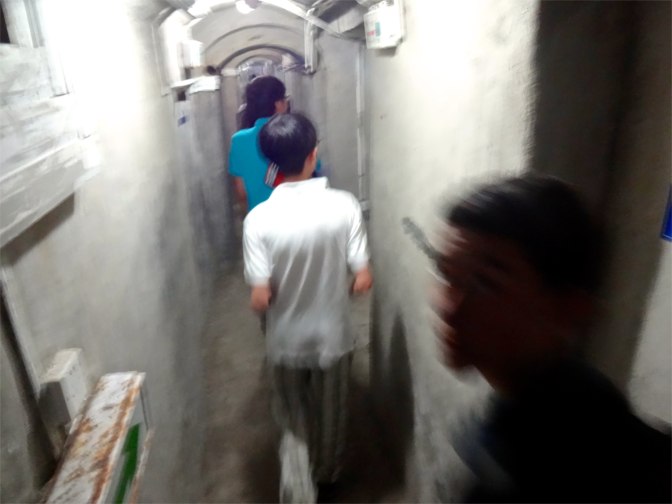 Students explore the dozens of rooms and narrow corridors that make up the underground fort built by the Germans in 1899 in a mountain high over Qingdao. They eventually surrendered the fort to a combined British and Japanese force in November 1914 early in the first World War.