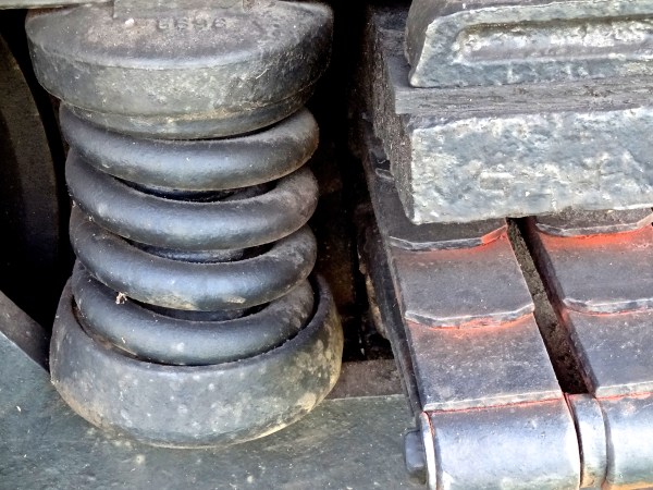 Massive springs on an old passenger train made for a smoother ride across the miles.