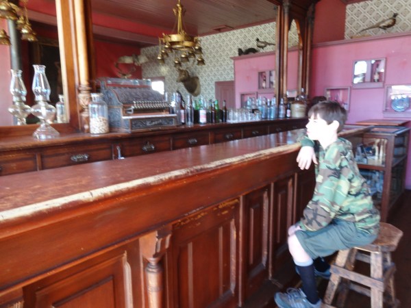 Alex bellies up to the bar in South Park City, Colorado.